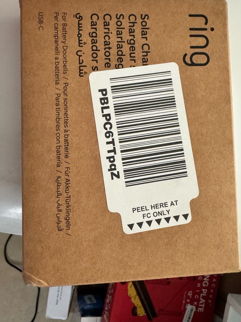 Ring Solar Charger Packaging in Brown with White Barcode Label